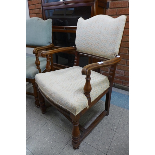 98 - A pair of walnut and upholstered open armchairs