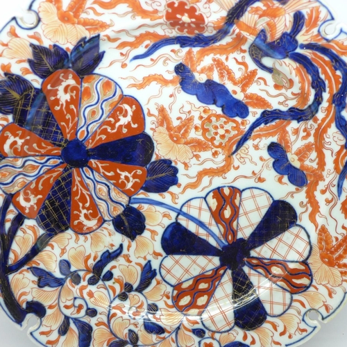 613 - A large Imari dish, rim restored, 31cm