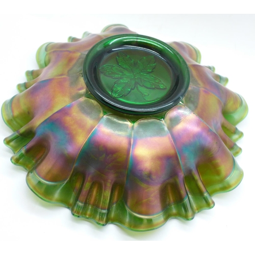 621 - A green carnival glass dish with wavy edge and grape design, 21.5cm