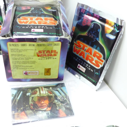 669 - Star Wars; a box of Merlin's Trilogy Collection Movie Trading Cards, 49 packets plus one opened, 5 c... 