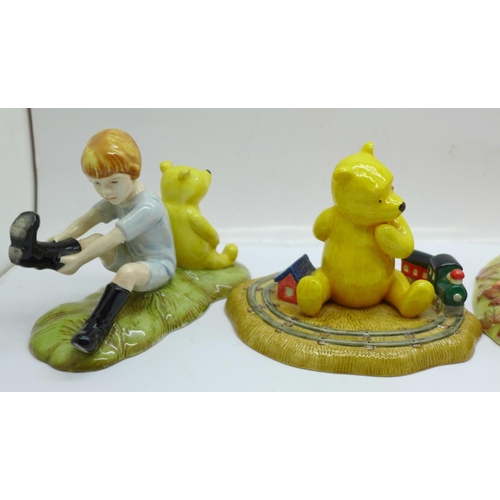 691 - A collection of five Royal Doulton Winnie the Pooh figures, boxed