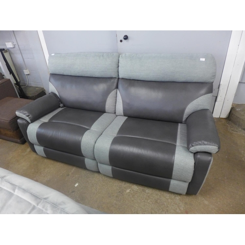 1522 - A black and grey upholstered electric reclining three seater sofa