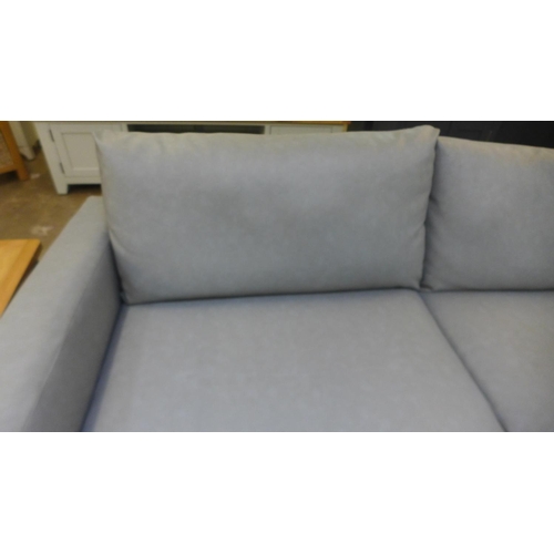 1534 - A grey faux leather corner sofa (repair to rear)