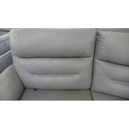 1554 - A Raffa grey leather electric reclining four seater sofa