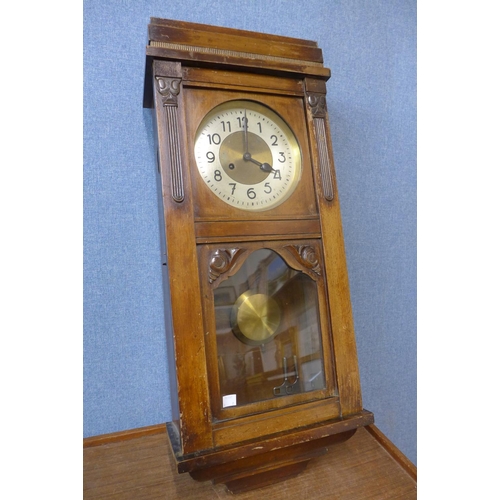 395 - A mahogany mantel clock and an oak wall clock