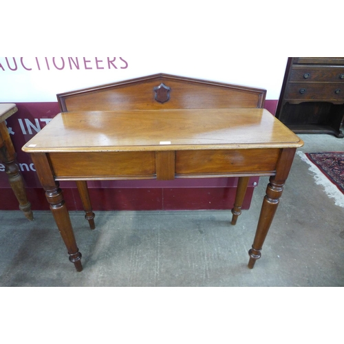 4 - A Victorian mahogany single drawer hall table