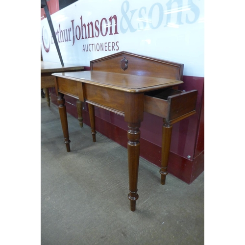 4 - A Victorian mahogany single drawer hall table