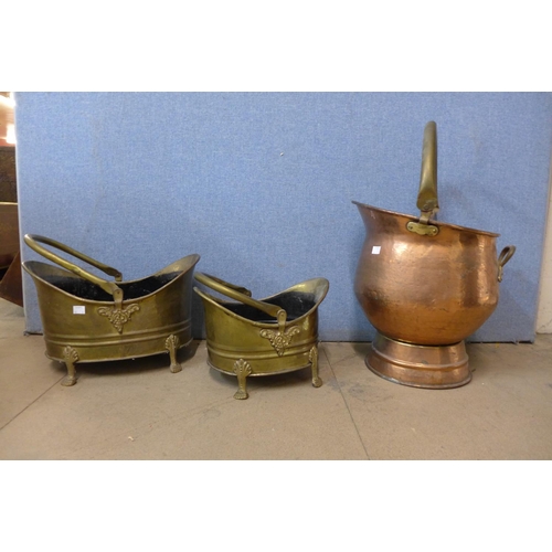 401 - A copper coal scuttle and two brass coal scuttles