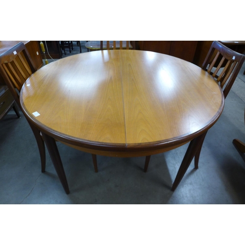 77 - A G-Plan Fresco teak extending dining table and four chairs