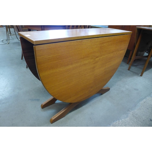 79 - A teak drop-leaf table