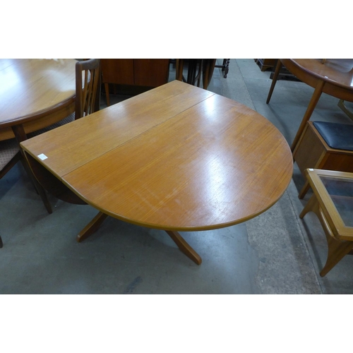 79 - A teak drop-leaf table