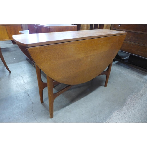 80 - A teak drop-leaf table