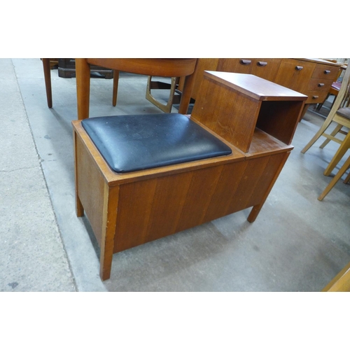 85 - A teak telephone seat