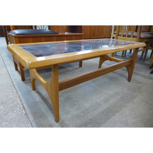 86 - A Stonehill teak and glass topped Stateroom coffee table