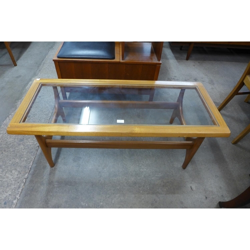 86 - A Stonehill teak and glass topped Stateroom coffee table