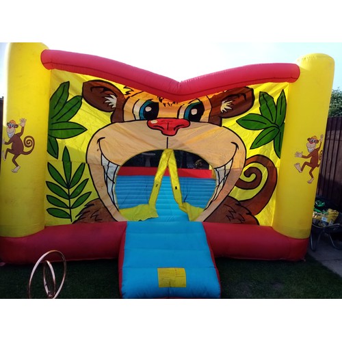 2441 - 12 x 12ft Red and Yellow Inflatable bouncy castle with 2 blowers - both working