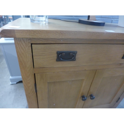 1515 - An oak two door small sideboard marked(NC-L2DR-PT)   *This lot is subject to VAT