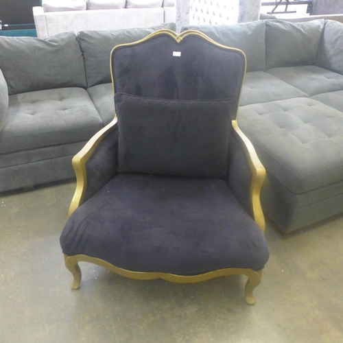 1566 - A dark blue upholstered armchair (marked)