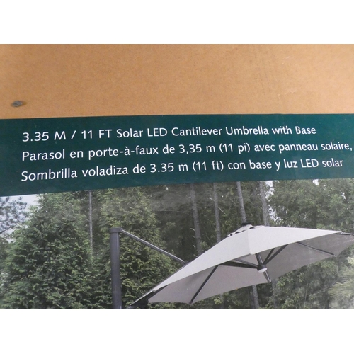 3444 - 11ft Cantilever Umbrella With LED Lights, RRP £541.66 + VAT (226-42) * This lot is subject to VAT