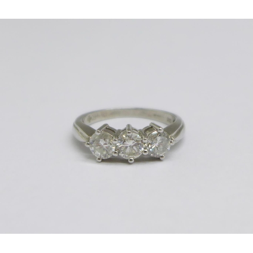 1297 - A platinum set three stone diamond ring, 6g, size P/Q, over 1 carat total weight diamond