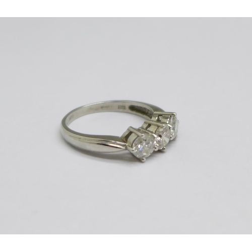 1297 - A platinum set three stone diamond ring, 6g, size P/Q, over 1 carat total weight diamond