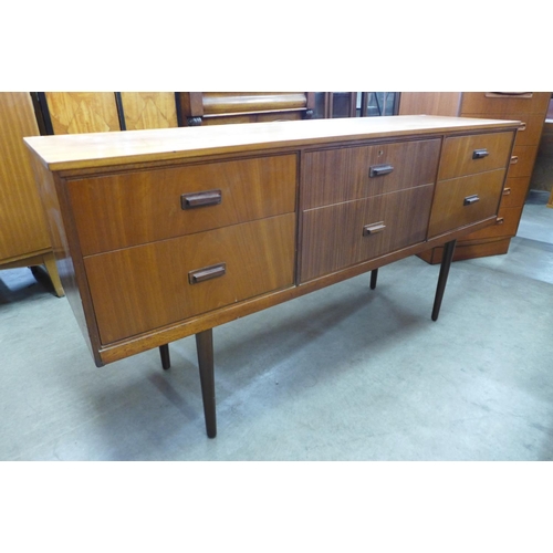 111 - A teak and afromosia sideboard