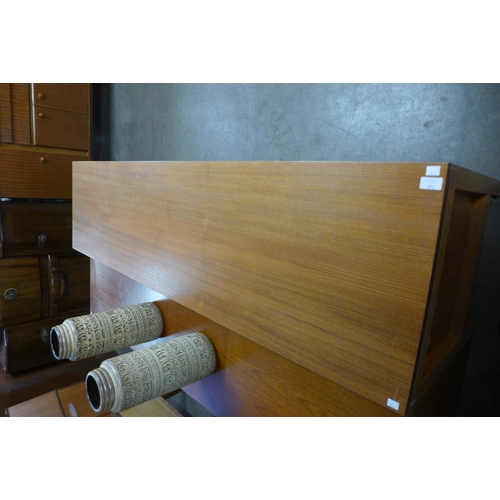 117A - A teak sliding two door sideboard