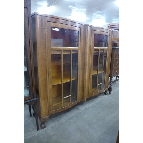 130 - A walnut bow front bookcase