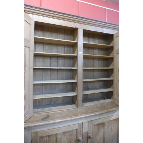 1 - A Victorian pine housekeeper's cupboard, 237cms h, 158cms w, 51cms d