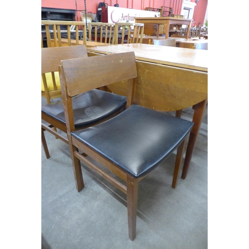 109 - A teak drop leaf table and four chairs