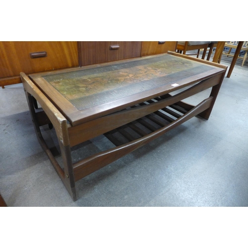 110 - A teak and copper topped Egyptian Revival coffee table