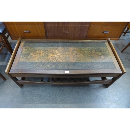 110 - A teak and copper topped Egyptian Revival coffee table