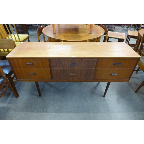 111 - A teak and afromosia sideboard