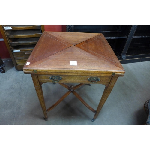 12 - An Edward VII mahogany envelope card table, stamped W. Walker & Sons, Bunhill Row, London E.C.