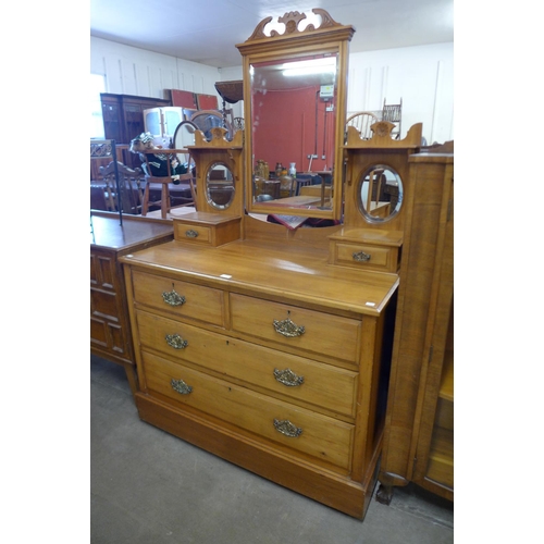 128 - A late Victorian satin birch dressing chest