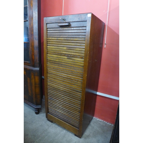 15 - An early/mid 20th Century oak tambour front filing cabinet