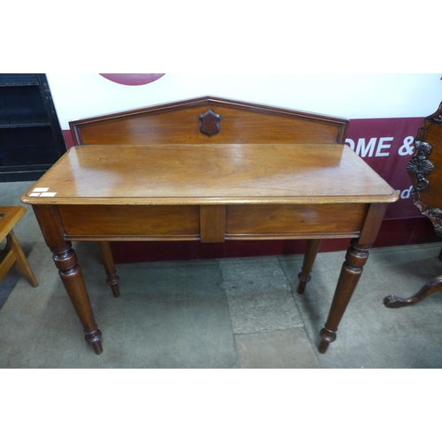 17 - A Victorian mahogany single drawer hall table