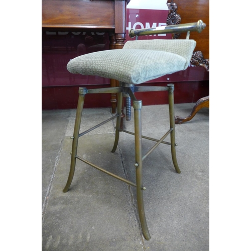 19 - A Victorian Aesthetic Movement brass revolving harpist's stool