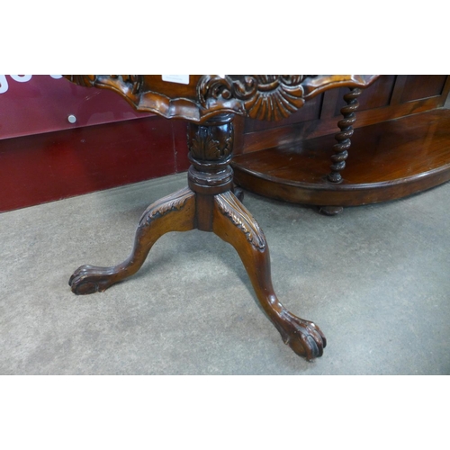 21 - A Chippendale Revival carved mahogany tilt-top birdcage action tripod table