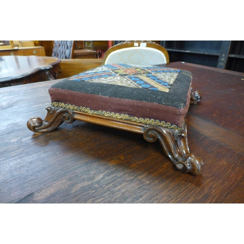 32 - An early Victorian rosewood and needlepoint beadwork footstool