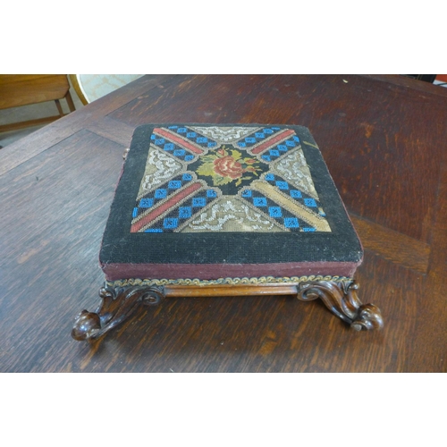 32 - An early Victorian rosewood and needlepoint beadwork footstool