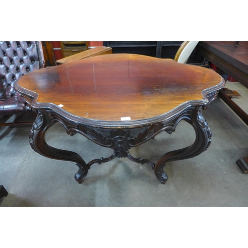 35 - A Victorian rosewood serpentine centre table