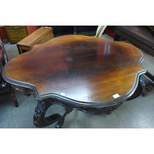 35 - A Victorian rosewood serpentine centre table