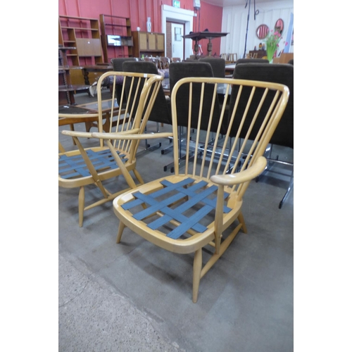 41 - A pair of Ercol Blonde beech 477 model Windsor armchairs