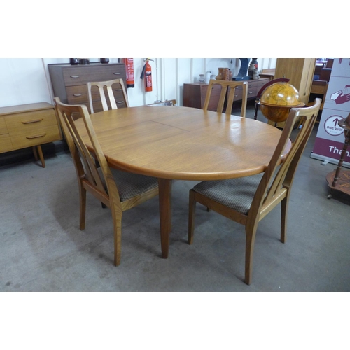 54 - A Nathan teak extending dining table and four chairs