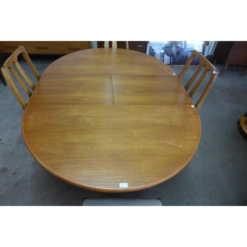 54 - A Nathan teak extending dining table and four chairs