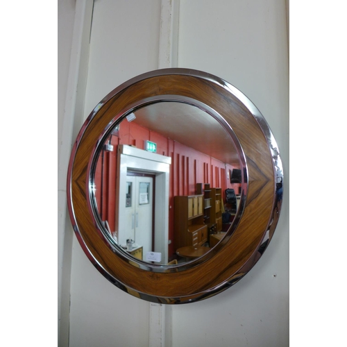 59 - A mid 20th Century chrome and walnut framed circular mirror