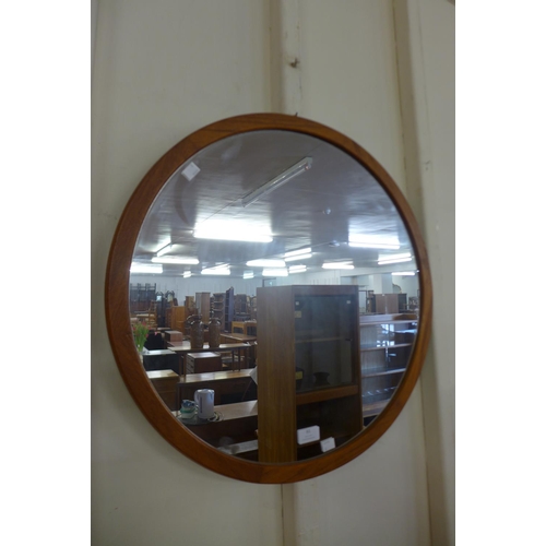 61 - A teak framed circular mirror