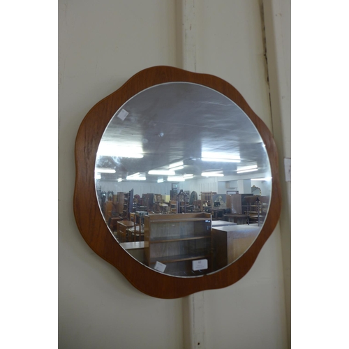 62 - A teak framed mirror