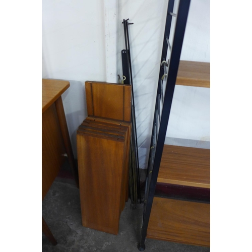 68 - A teak and black metal Ladderax room divider with extra shelving